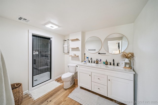 210 NW 4th St, Checotah, OK 74426 - full bathroom featuring double vanity, wood finished floors, and a stall shower