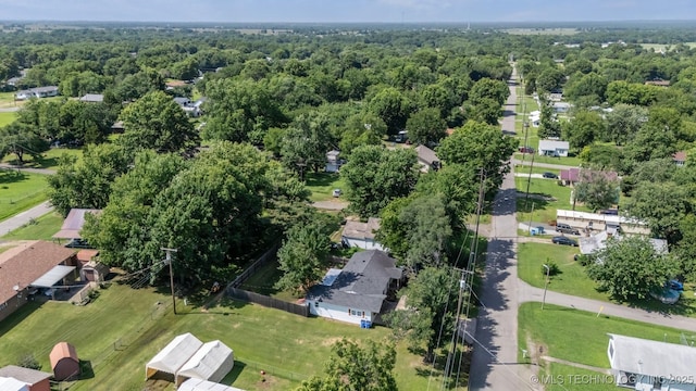 210 NW 4th St, Checotah, OK 74426 - aerial overview of property's location featuring a heavily wooded area