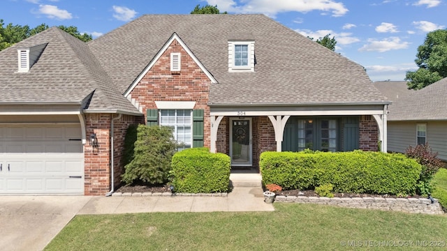 304 S 63rd St, Broken Arrow, OK 74014 - view of front of property featuring brick siding, roof with shingles, a garage, a front lawn, and driveway