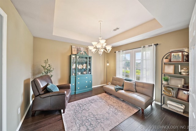 304 S 63rd St, Broken Arrow, OK 74014 - living area featuring a raised ceiling, a chandelier, and dark wood-type flooring