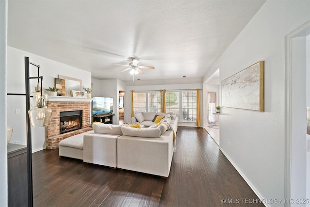 304 S 63rd St, Broken Arrow, OK 74014 - living area with ceiling fan, dark wood finished floors, and a brick fireplace