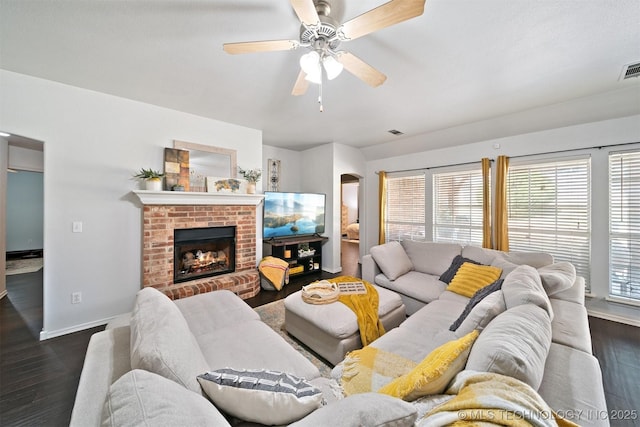 304 S 63rd St, Broken Arrow, OK 74014 - living room featuring dark wood finished floors, ceiling fan, healthy amount of natural light, and arched walkways