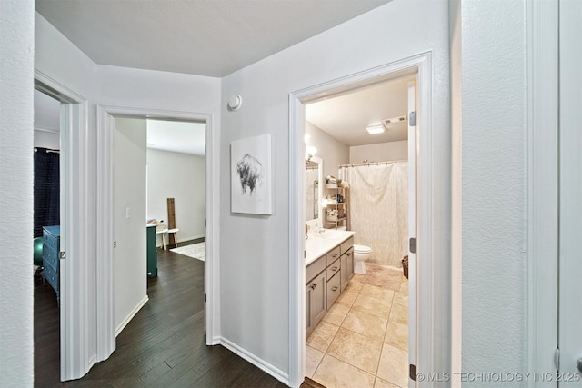 304 S 63rd St, Broken Arrow, OK 74014 - bathroom featuring vanity, wood finished floors, and a shower with shower curtain
