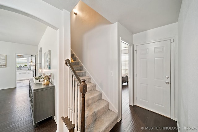 304 S 63rd St, Broken Arrow, OK 74014 - foyer with dark wood-type flooring, stairway, and arched walkways