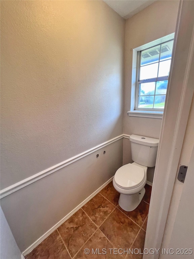 3610 Magnolia Dr, Sand Springs, OK 74063 - bathroom featuring toilet and tile patterned floors