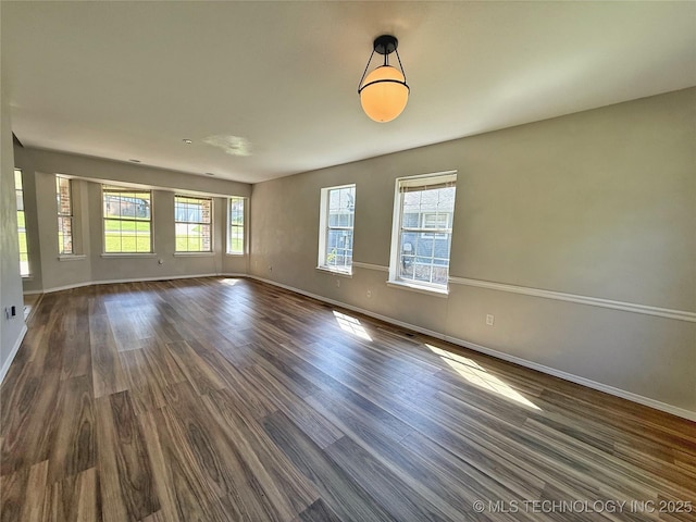 3610 Magnolia Dr, Sand Springs, OK 74063 - unfurnished room featuring dark wood-type flooring and baseboards