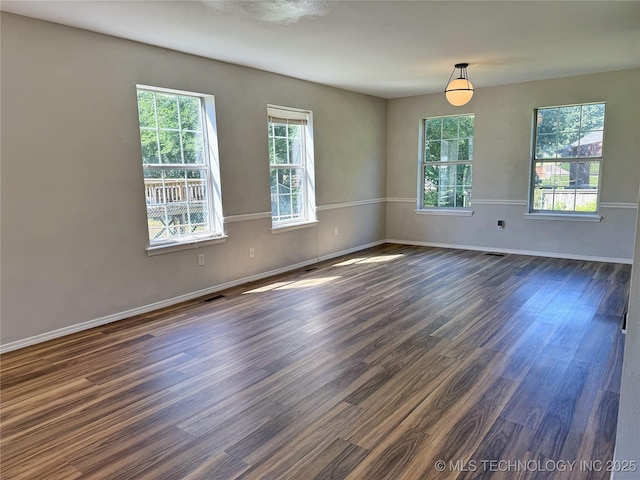 3610 Magnolia Dr, Sand Springs, OK 74063 - empty room with plenty of natural light and dark wood-type flooring