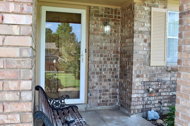 12329 E 18th St, Tulsa, OK 74128 - property entrance featuring brick siding