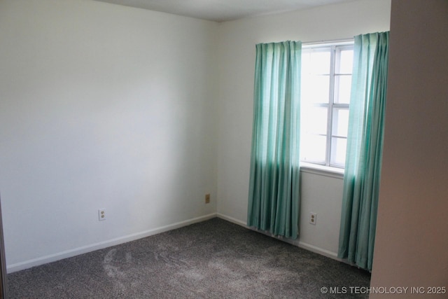 12329 E 18th St, Tulsa, OK 74128 - spare room featuring dark carpet and baseboards