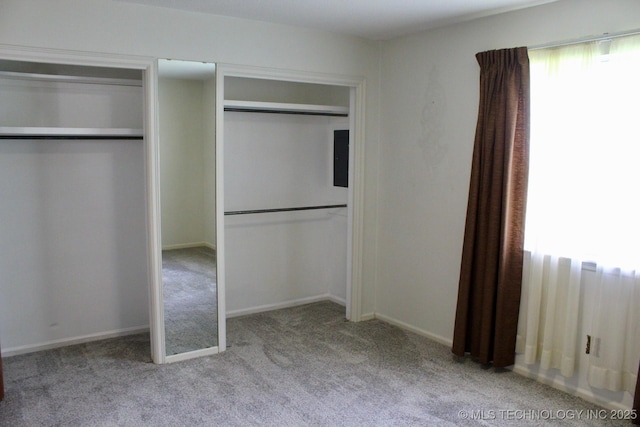 12329 E 18th St, Tulsa, OK 74128 - unfurnished bedroom with carpet floors and multiple closets