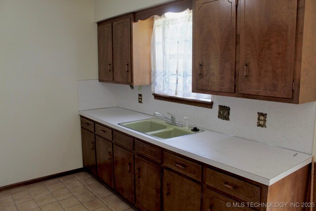 12329 E 18th St, Tulsa, OK 74128 - kitchen featuring a sink and light countertops