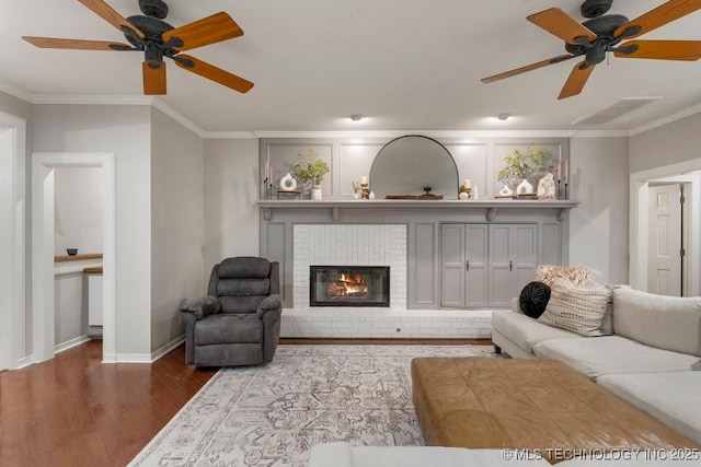 8766 Haskell Dr, Broken Arrow, OK 74014 - living room with ceiling fan, crown molding, wood finished floors, and a fireplace