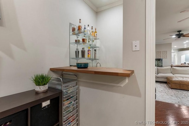 8766 Haskell Dr, Broken Arrow, OK 74014 - indoor wet bar featuring crown molding, a ceiling fan, wood finished floors, and recessed lighting