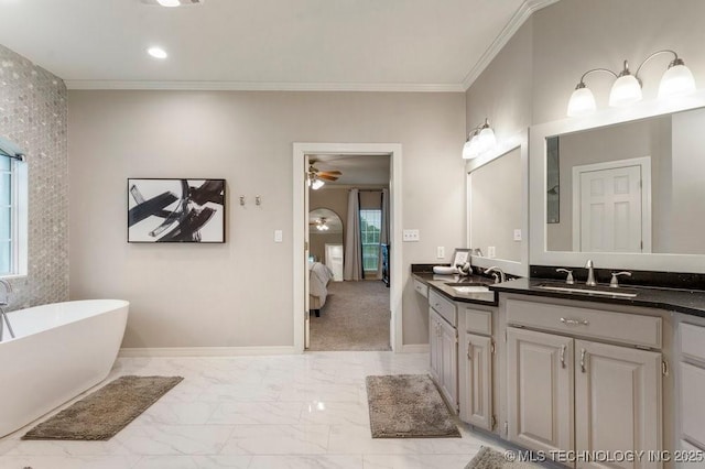 8766 Haskell Dr, Broken Arrow, OK 74014 - full bathroom with connected bathroom, vanity, a freestanding bath, healthy amount of natural light, and ornamental molding