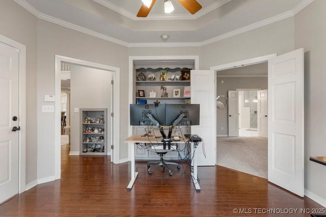 8766 Haskell Dr, Broken Arrow, OK 74014 - home office featuring a ceiling fan, wood finished floors, built in features, crown molding, and a tray ceiling