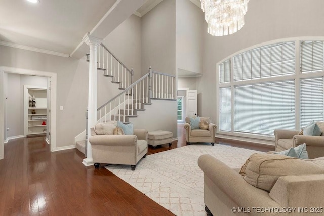 8766 Haskell Dr, Broken Arrow, OK 74014 - living area with stairs, hardwood / wood-style floors, ornamental molding, and a chandelier