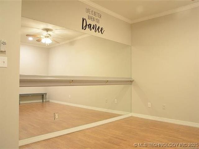 8766 Haskell Dr, Broken Arrow, OK 74014 - empty room featuring crown molding, wood finished floors, and ceiling fan