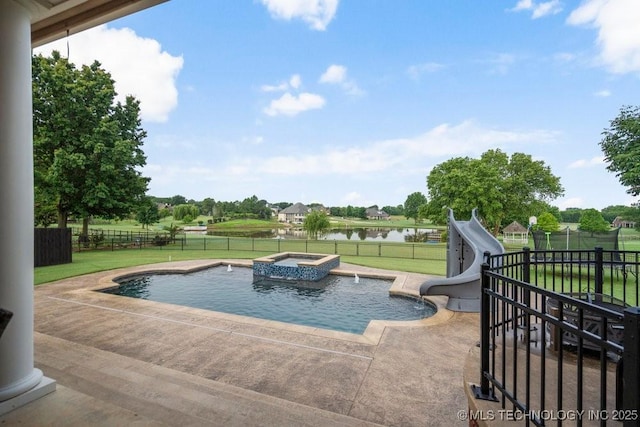 8766 Haskell Dr, Broken Arrow, OK 74014 - view of swimming pool featuring a water slide, a fenced backyard, a water view, a patio, and a pool with connected hot tub