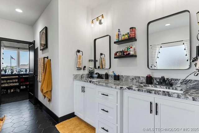21933 E 101st Pl S, Broken Arrow, OK 74014 - bathroom featuring double vanity, recessed lighting, and tile patterned flooring