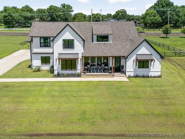 21933 E 101st Pl S, Broken Arrow, OK 74014 - modern inspired farmhouse featuring roof with shingles, a front yard, and a porch