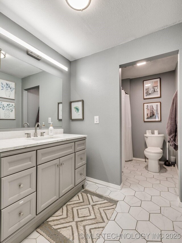 2016 W Easton St, Tulsa, OK 74127 - bathroom featuring vanity, a textured ceiling, and tile patterned floors