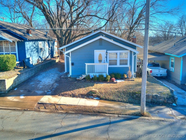 2016 W Easton St, Tulsa, OK 74127 - bungalow-style house featuring a chimney