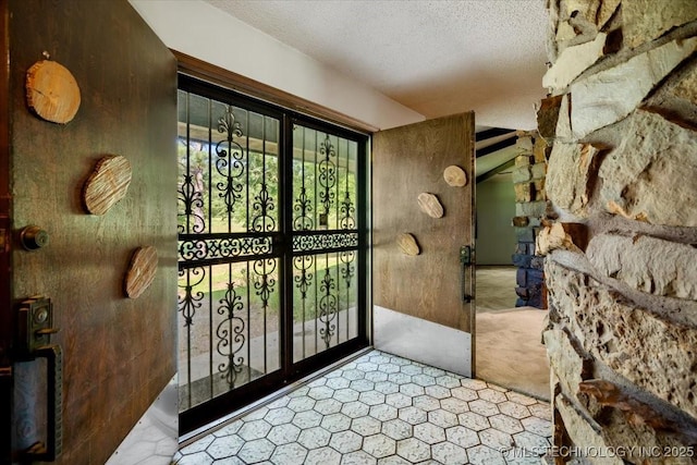 1943 W 163rd St, Skiatook, OK 74070 - doorway featuring a textured ceiling and carpet