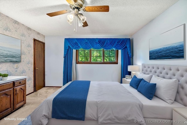 1943 W 163rd St, Skiatook, OK 74070 - bedroom with a textured ceiling, light carpet, wallpapered walls, and a ceiling fan