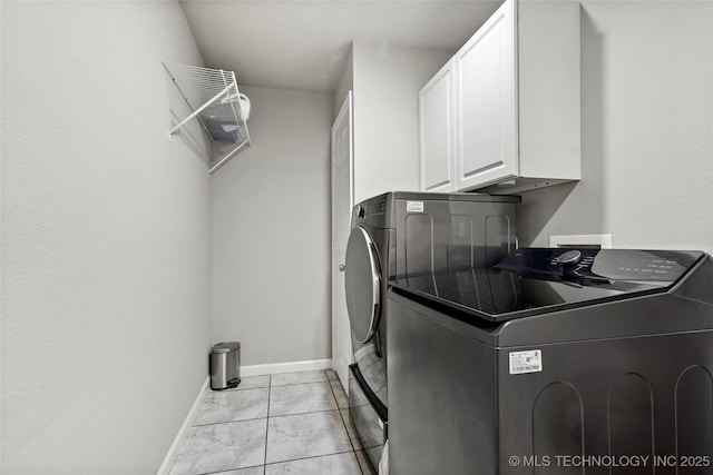 1628 E 45th Pl, Tulsa, OK 74105 - laundry area featuring washer and dryer, cabinet space, and light marble finish flooring