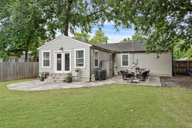 1628 E 45th Pl, Tulsa, OK 74105 - rear view of house featuring a patio, entry steps, and a fenced backyard