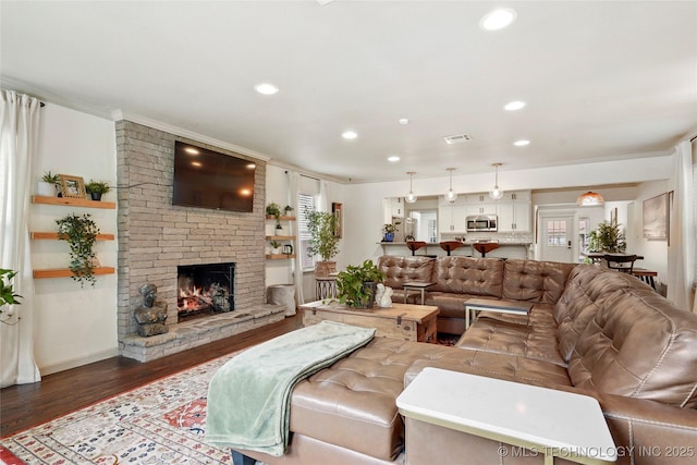 1628 E 45th Pl, Tulsa, OK 74105 - living area with wood finished floors, recessed lighting, and a large fireplace