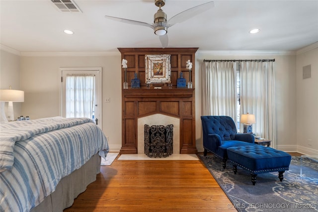 1249 E 26th St, Tulsa, OK 74114 - bedroom with wood finished floors, ornamental molding, ceiling fan, and recessed lighting