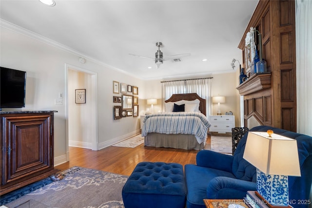 1249 E 26th St, Tulsa, OK 74114 - bedroom with crown molding, wood finished floors, recessed lighting, and a ceiling fan