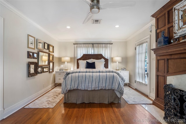 1249 E 26th St, Tulsa, OK 74114 - bedroom featuring wood finished floors, crown molding, and recessed lighting