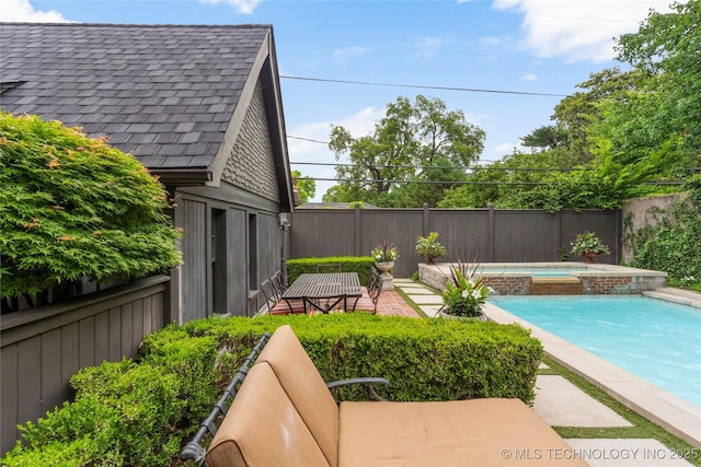 1249 E 26th St, Tulsa, OK 74114 - view of pool with a pool with connected hot tub