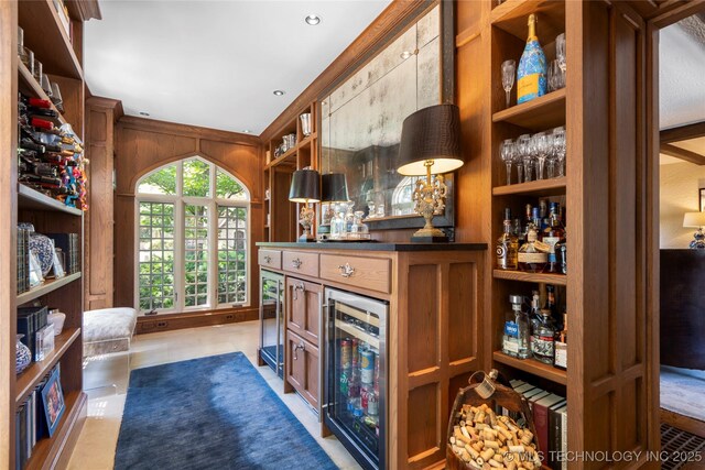 1249 E 26th St, Tulsa, OK 74114 - office with wine cooler, a bar, and built in shelves