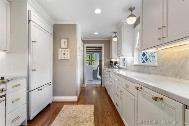 1249 E 26th St, Tulsa, OK 74114 - kitchen featuring crown molding, dark wood-style floors, backsplash, white cabinets, and light stone countertops