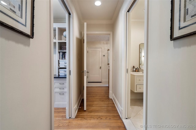 1249 E 26th St, Tulsa, OK 74114 - hallway featuring ornamental molding, light wood-style flooring, and recessed lighting