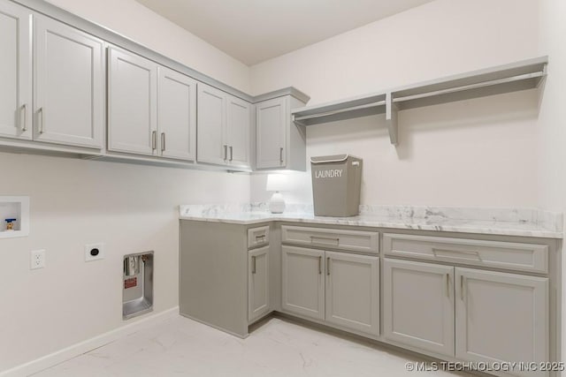 6501 S Fir Ave, Broken Arrow, OK 74134 - laundry area featuring cabinet space, hookup for an electric dryer, light marble finish flooring, and washer hookup