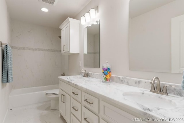 6501 S Fir Ave, Broken Arrow, OK 74134 - full bathroom with double vanity, marble look tile flooring, recessed lighting, and washtub / shower combination