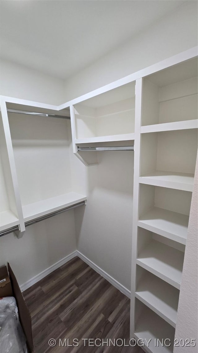 1135 E Zion St, Tulsa, OK 74106 - walk in closet with dark wood-style flooring