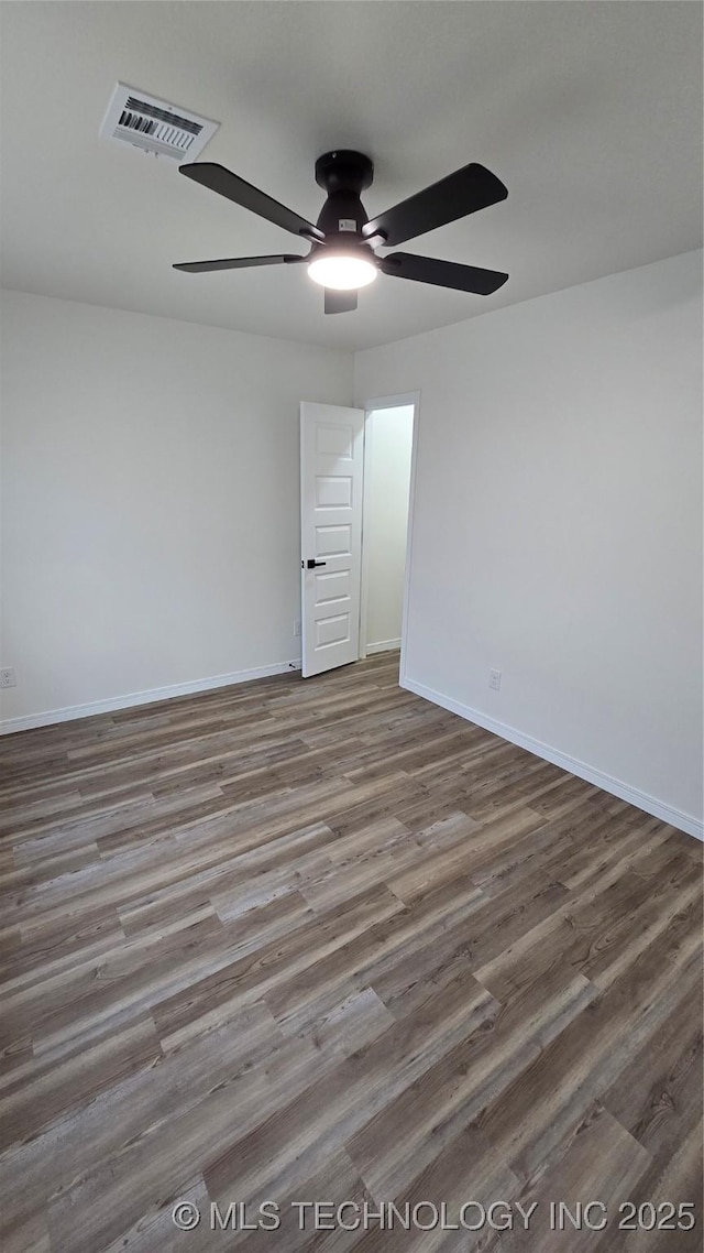 1135 E Zion St, Tulsa, OK 74106 - empty room with ceiling fan and wood finished floors
