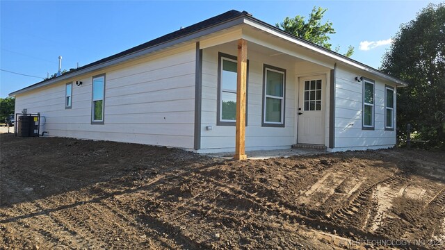 1135 E Zion St, Tulsa, OK 74106 - view of side of home featuring a central air condition unit