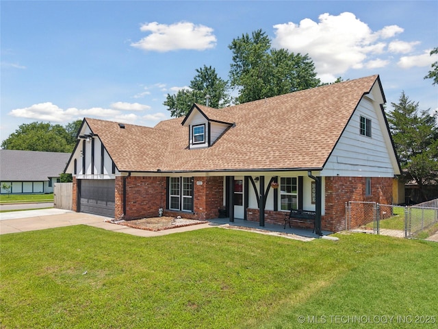 10905 E 24th St, Tulsa, OK 74129 - tudor-style house with brick siding, a porch, driveway, and roof with shingles