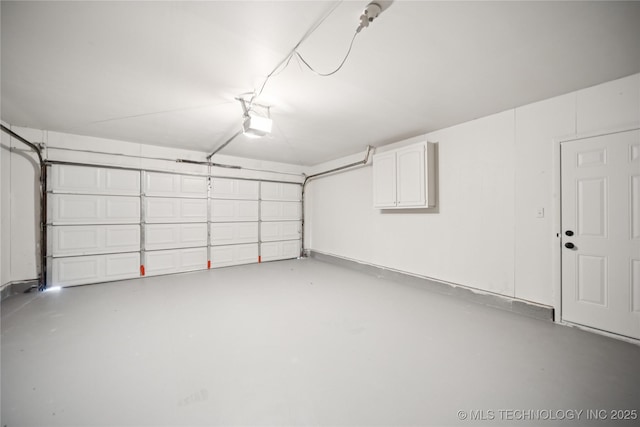 10905 E 24th St, Tulsa, OK 74129 - garage featuring a garage door opener
