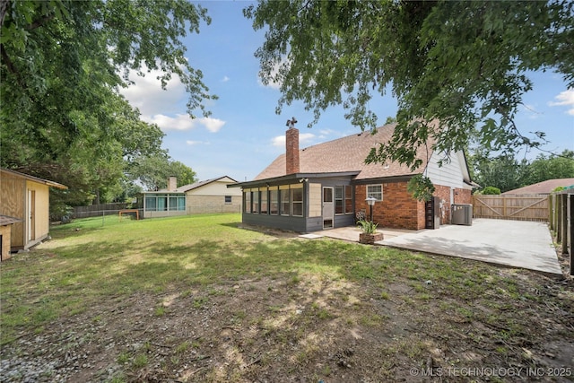 10905 E 24th St, Tulsa, OK 74129 - fenced backyard featuring a sunroom and a patio