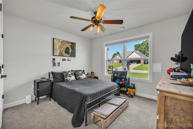 25133 Shade Tree Pl, Claremore, OK 74019 - bedroom with light colored carpet and a ceiling fan
