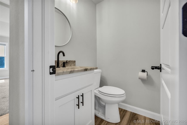 25133 Shade Tree Pl, Claremore, OK 74019 - half bath featuring vanity and wood finished floors