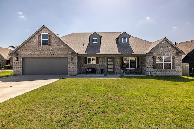 25133 Shade Tree Pl, Claremore, OK 74019 - view of front of home featuring brick siding, concrete driveway, a garage, a front yard, and a shingled roof