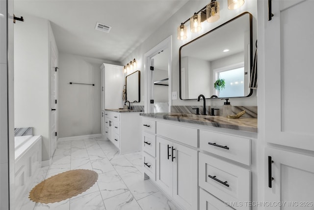 25133 Shade Tree Pl, Claremore, OK 74019 - full bath with marble look tiles, two vanities, and recessed lighting